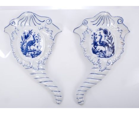 Pair 18th century Worcester porcelain blue and white cornucopia wall pockets with moulded decoration and printed peacock and 