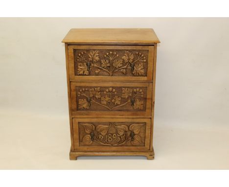 Late 19th century Arts & Crafts-style carved pine chest of drawers with three relief carved drawers, each with original drop-