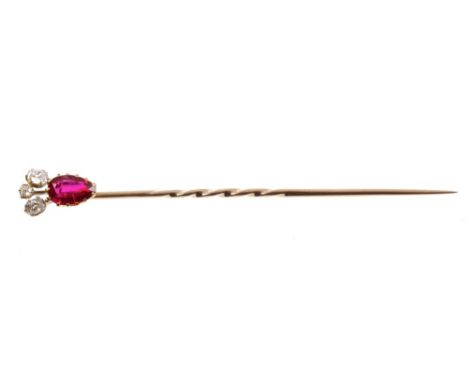 Victorian ruby and diamond stick pin, the pear cut ruby surmounted by three old cut diamonds in gold claw setting CONDITION R