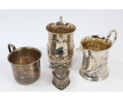 Victorian silver christening mug of baluster form, with embossed scroll and foliate decoration, engraved cartouche and scroll