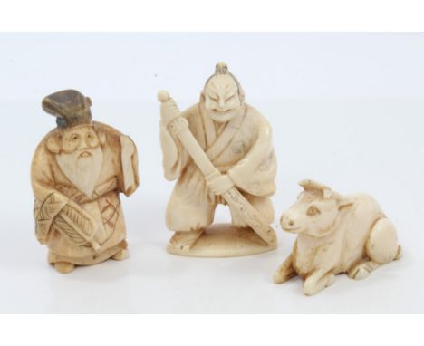 Three late 19th century Japanese carved ivory netsuke figures including swordsman and cow