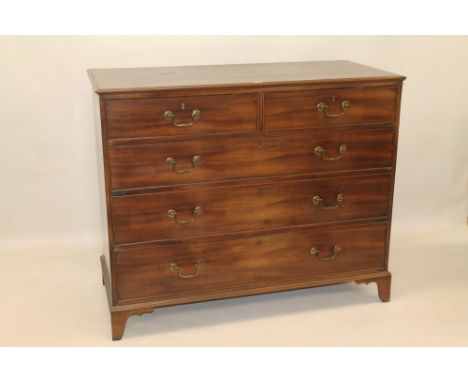 George III mahogany chest having two short over three long graduated drawers with original brass swan neck handles on bracket