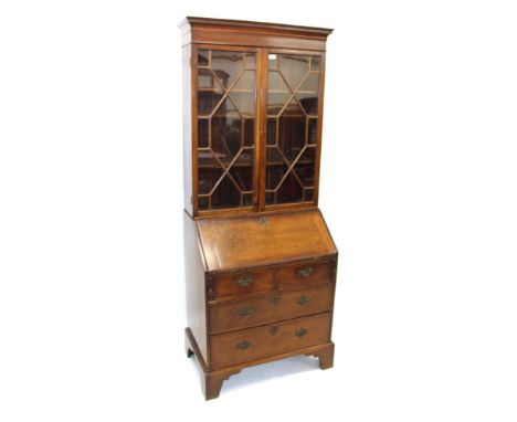 George III and later mahogany bureau bookcase, the top with Greek key moulded cornice and adjustable shelves enclosed by twin