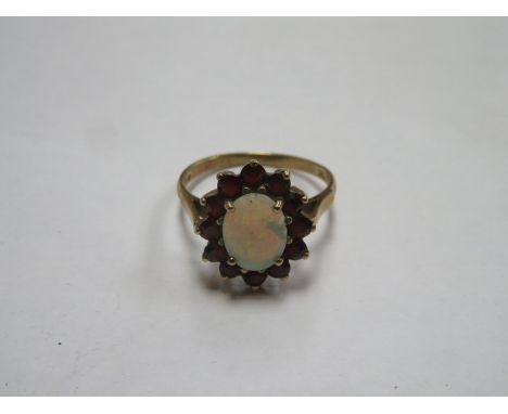 9ct GOLD DRESS RING SET WITH OPAL AND RUBY COLOURED STONES 