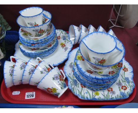 Art Deco Style Part Tea Set in The Decoration of Shelly, consisting of twelve side plates, twelve saucers, ten cups, two suga