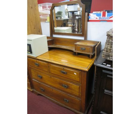 An Early XX Century Dressing Table, with a central mirror, two short and three long, on bracket feet.