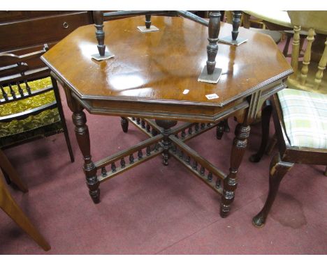 An Early XX Century Walnut Octagonal Shaped window Table, on reeded supports, X stretcher with finial.
