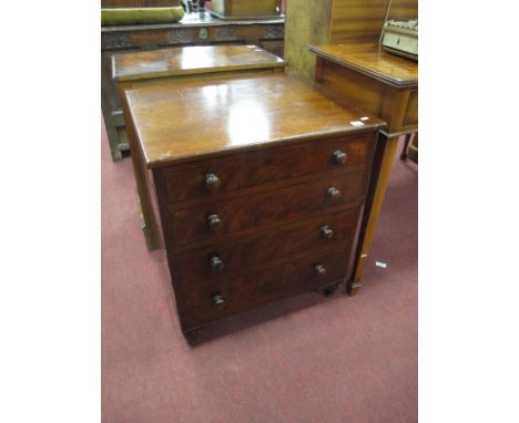 A Georgian Mahogany Commode as a Chest of four Drawers, having turned handles and feet, 63cm wide.