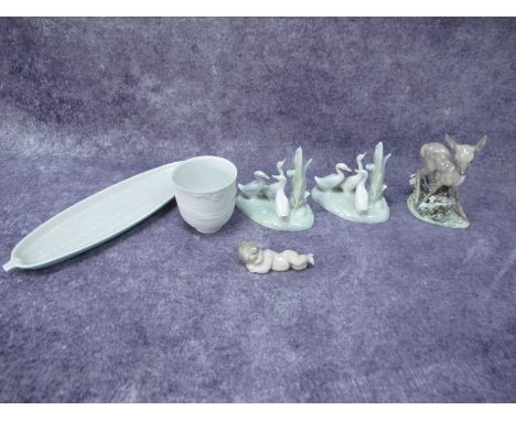 Lladro Collectors Society 1999 Cup, Lladro cherub, Poole dish, Lladro figure group of a fawn and two Neo figure groups of duc