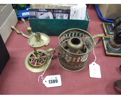 XIX Century Brass Camber Candlestick with a scissor release action, circular pierced base, finger grip, together with one oth