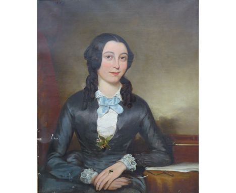 British School (19th century): a half length portrait of a young woman sat at a desk, oil on canvas, a/f, 73.5 by 61.5cm, gil