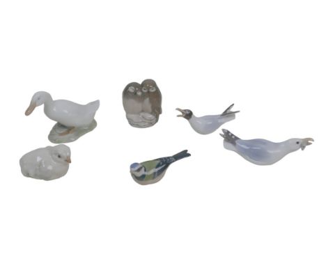 Six Royal Copenhagen and Bing &amp; Grondahl figurines of birds, comprising four Royal Copenhagen figurines, a goose (1192), 