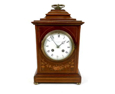 An Edwardian mahogany and inlaid mantel clock, white enamel dial, 10cm, signed Pearce &amp; Sons, Leeds, with black Roman num
