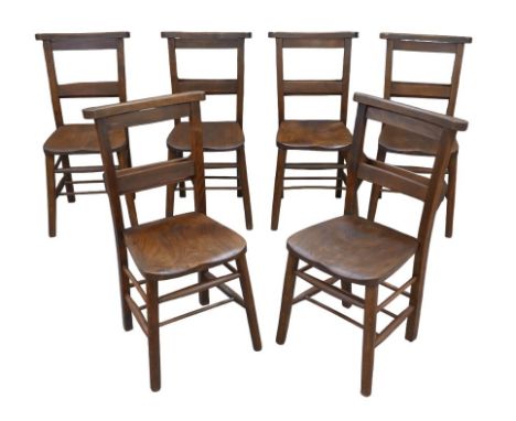 A set of six early 20th century chapel chairs with elm seats, single prayer book trough to the rear of each back rest.  (6) 