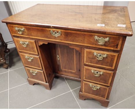 George III inlaid walnut ladies kneehole writing desk having the banks of drawers flanking a cupboard concealing three hidden