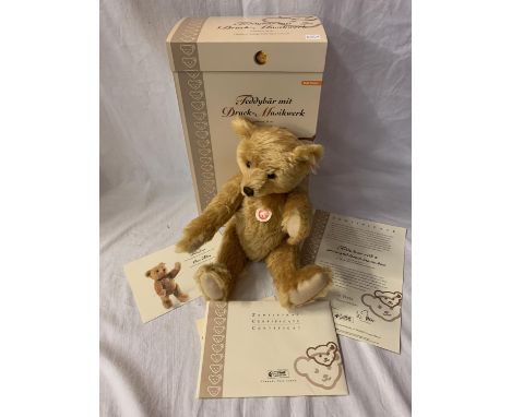 A STEIFF TEDDY BEAR WITH A PRESS AND LISTEN MUSIC BOX WITH BOX AND CERTIFICATE 