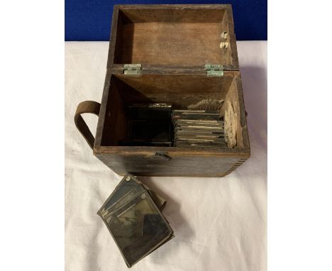 A VINTAGE WOODEN BOX CONTAINING VICTORIAN GLASS SLIDES 