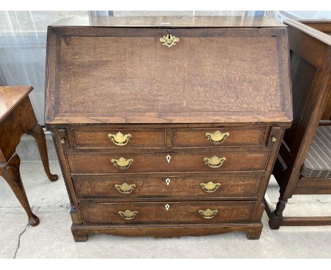 A GEORGE III OAK FALL FRONT BUREAU ON BRACKET FEET, WITH FITTED INTERIOR, 40" WIDE 