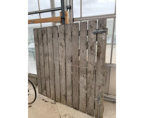 A VERY LARGE SLATTED WOODEN YARD GATE, WIDTH 182CM, HEIGHT 180CM 