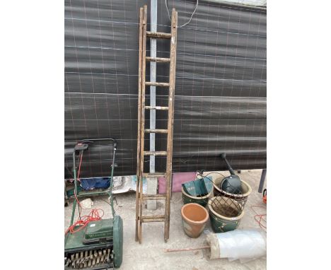 A TWO SECTION 18 RUNG WOODEN LADDER 
