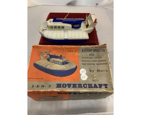 A VINTAGE BOXED TOY HOVERCRAFT BY 'MARX' 