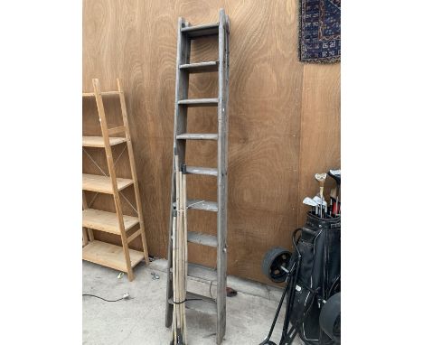 A VINTAGE NINE RUNG STEP LADDER WITH A SET OF VINTAGE DRAINING RODS 