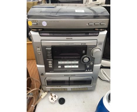 AN AIWA HI-FI PLAYER WITH INTEGRATED CD/TAPE AND RECORD PLAYER BELIEVED IN WORKING ORDER BUT NO WARRANTY 