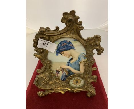A BRASS ART NOUVEAU MANTLE CLOCK 