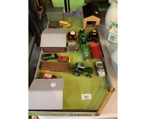 A WOODEN FARM YARD LAYOUT WITH SHEDS AND DIECAST VEHICLES TO INCLUDE A JOHN DEERE LOW LOADER WAGON AND TRACTOR 