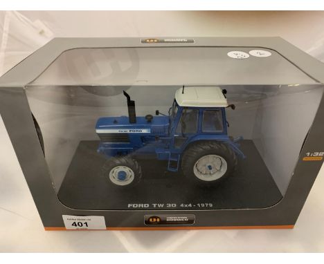 A BOXED UNIVERSAL HOBBIES DIE CAST FORD TRACTOR 1:32 