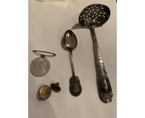 A LADLE STYLE TEA STRAINER POSSIBLY SILVER, AN EPNS TEASPOON, A GEORGE 6TH CORONATION MEDAL AND A BRASS PIN 