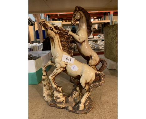 A PAIR OF LARGE DESIGNER CERAMIC REARING HORSES 