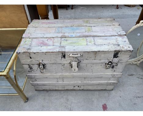 A DOMED TOP TRAVELLING TRUNK AND CREAM TRIPLE DRESSING MIRROR 