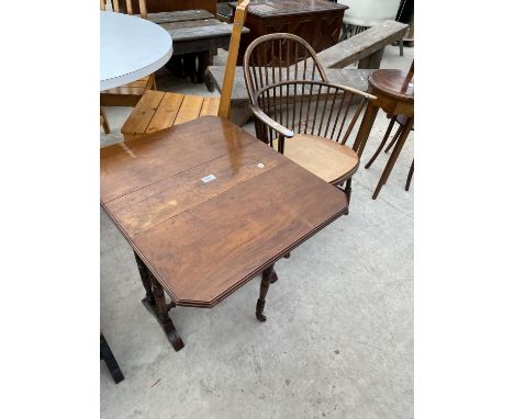 AN EDWARDIAN MAHOGANY SUTHERLAND TABLE AND COMB BACK WINDSOR STYLE CHAIR 