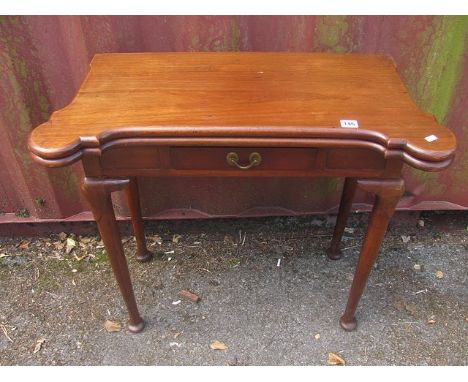 A mahogany fold over card table, the shaped top with later replacement baize, single frieze drawer on cabriole legs and pad f