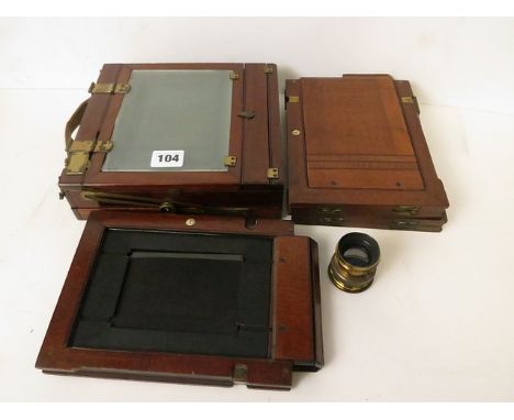 A 19th century mahogany and brass folding plate camera with three slides