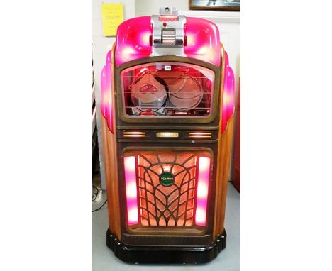 A 1947 Packard Pla-Mor juke box, 78rpm player, serial No. 3491 FVA, Linier record rack, in walnut veneered cabinet, red Catal