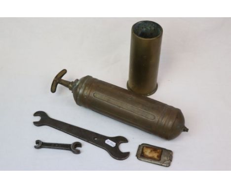 A Small Collection Of Militaria To Include A Brass Artillery Shell Case, A Military Issue Pyrene Carbon Hand Pump Fire Exting