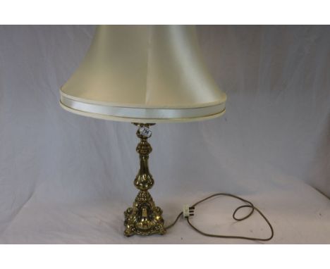 A brass table lamp of classical form with shade 