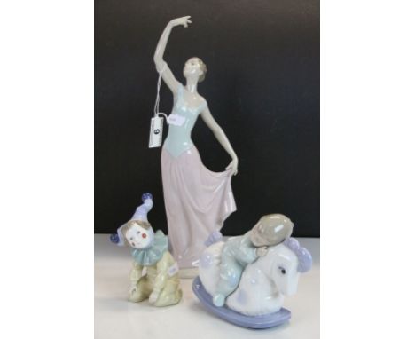 Three vintage Boxed Nao ceramic figurines to include a Child asleep on a Rocking Horse
