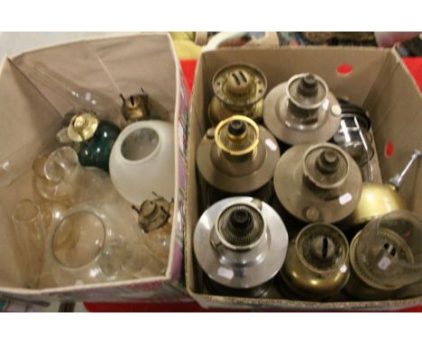 A large quantity of vintage oil lamps and a hurricane lamp