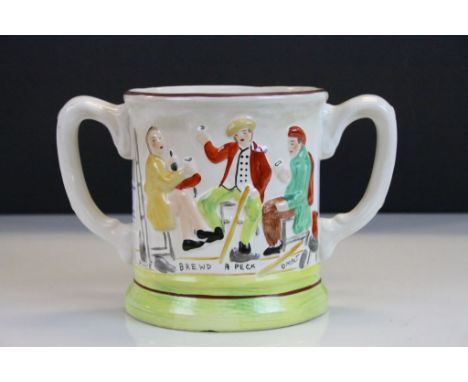 19th Century Staffordshire twin handled Loving Cup with figural decoration &amp; marked "Willie Brewd a Peck o Malt" and havi