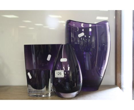 Four Amethyst colour Art Glass vases, various designs, the largest approx 30cm tall