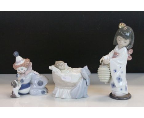 Three boxed Lladro ceramic Figurines to include Oriental Girl, Clown with Puppy &amp; Baby in a Crib