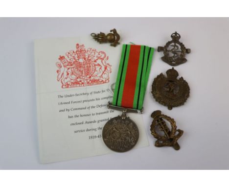 A Full Size World War Two / WW2 British Defence Medal With Original Ribbon And Paperwork Together With A Collection Of Badges