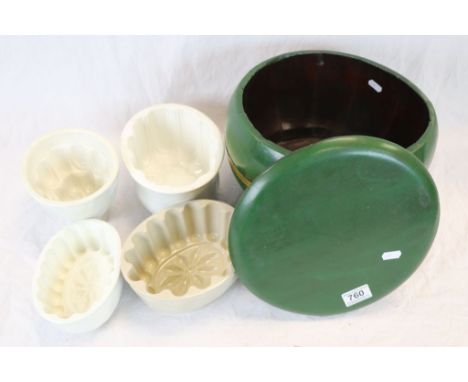 Four vintage ceramic jelly moulds and a lidded painted coopered storage jar.
