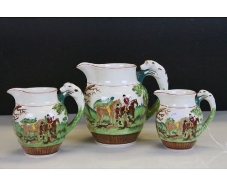 A set of three Wedgwood&nbsp;D'Ye Ken John Peel graduating jugs with fox hunting scenes
