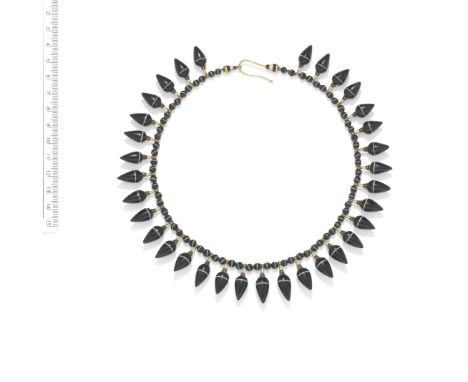 ARCHAEOLOGICAL REVIVAL GOLD, SARDONYX AND ENAMEL FRINGE NECKLACE, CIRCA 1860The banded sardonyx amphorae suspended from a str