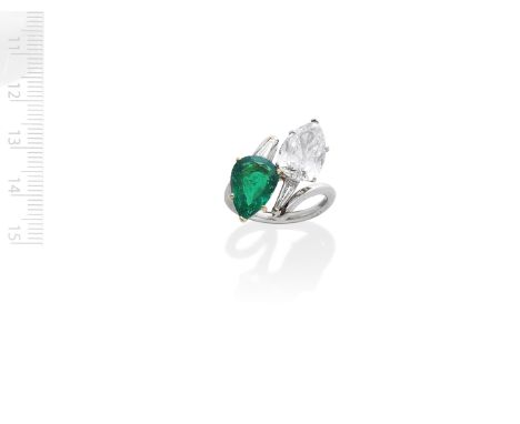 EMERALD AND DIAMOND 'TOI ET MOI' RINGObliquely-set with a pear-shaped emerald, weighing 3.40 carats, and a pear-shaped diamon