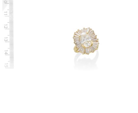 DIAMOND CLUSTER RINGThe oval-cut diamond, weighing 3.59 carats, within an undulating surround of tapered baguette-cut diamond